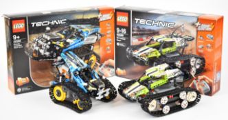 Two Lego Technic remote controlled off road vehicles comprising 42065 and 42095, both assembled with