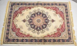Persian rug with navy blue and red decoration on an ivory ground, 230 x 158cm