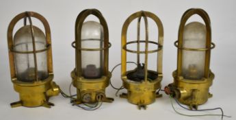 Set of four brass ship's / nautical caged bulkhead electric lights, H24cm