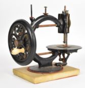 Little Wanzer 19th century sewing machine, circa 1870, serial number 82353, on marble or similar