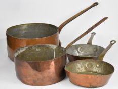 Four 19th / 20thC copper saucepans / pans, some initialled but unnamed, largest diameter 35 x height