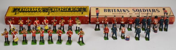 Thirty-four vintage Britains painted metal toy soldiers comprising 'Drums and Bugles of the Line'