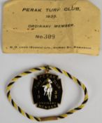 1933 Perak Turf Club enamel member's badge, with original envelope