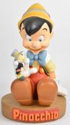 Walt Disney Parks & Resorts resin Pinocchio figure and plinth, height 50cm.