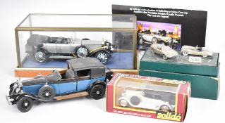 Three diecast model vintage cars by Franklin Mint and similar, one in a glass display case, together