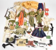 Three Palitoy Action Man figures all with painted hair, together with a collection of clothing and