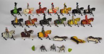 Nineteen Timpo or similar painted metal Medieval Knights, mounted on horseback.