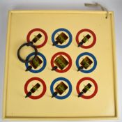 A nine hook wooden Hoopla game with score markers and three rings, 63cm x 63cm.