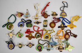 A collection of Down Royal Corporation of Horse Breeders metal and enamel horse racing badges