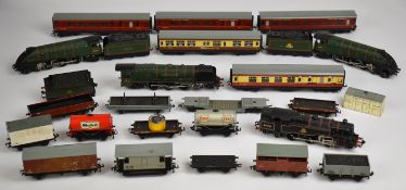 Hornby Dublo comprising two A4 Pacifics, Duchess, 4MT tank, five coaches and thirteen goods wagons.