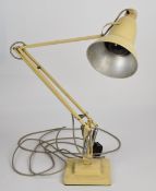 Herbert Terry Anglepoise lamp raised on a square stepped base with cream paint