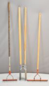 Spear & Jackson post hole digger and two Wolf Tools lawn scarifiers