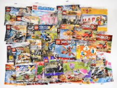 Fifty-two Lego minifigures to include The Hobbit, Ninjago, Teenage Mutant Ninja Turtles, Legends