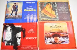 Eight British quad film posters comprising Crocodile Dundee II (x2), The Last Emperor, Throw Momma