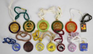 A collection of metal and enamel Irish horse racing badges including Fairyhouse, Dundalk, Limerick