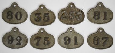 Eight cast metal wine bin labels / tickets, most with L. Lumley & Co, America Square, London