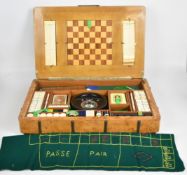 Art Deco walnut and burr walnut games compendium with continental silver fretwork and enamel playing