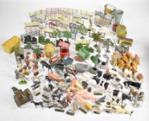A collection of Britains and similar painted metal and plastic farm animals and figures.