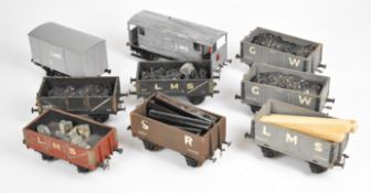 Nine 0 gauge model railway goods wagons to include Great Western, LMS and Southern.