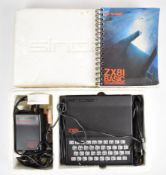 Sinclair ZX81 computer with power supply, cables, instruction manual and polystyrene outer sleeve.