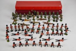 Sixty-seven Britains painted metal toy soldiers comprising British Grenadier Guards and General