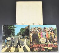 Three The Beatles LPs comprising The Beatles (White Album) (PCS 7067) with top opening numbered