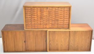 Mid Century, modern set of three rosewood floating wall cabinets, two with sliding doors and one