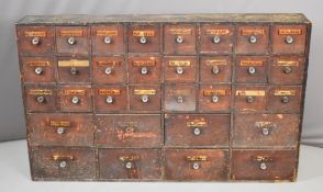 19th / 20thC apothecary / shop display / advertising chest of thirty two graduated drawers, some
