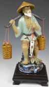 Chinese pottery figure with yoke, H34cm