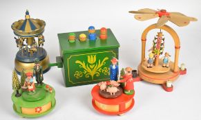 Five German Erzgebirge wooden folk art music box toys, tallest 20cm.