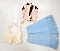 Victorian / Edwardian clothing comprising a blue skirt, red velvet and lace corseted blouse,