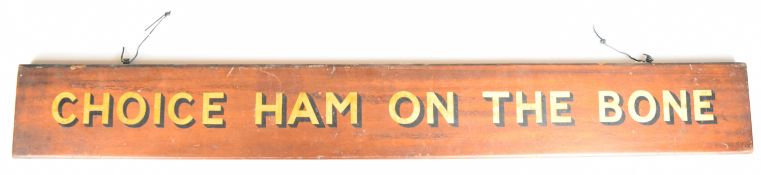 Vintage butcher's wooden advertising sign 'Choice Ham On The Bone', with gold and black lettering,
