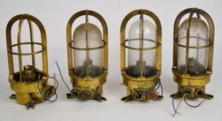 Set of four brass ship's / nautical caged bulkhead electric lights, H24cm