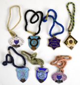 Seven Baldoyle Races metal and enamel horse racing badges including Subscribers Stand 1894, 1924 and