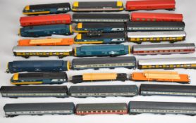 A collection of mostly Hornby 00 gauge model railway locomotives and passenger carriages to