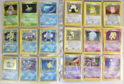 One hundred and forty Pokémon cards comprising Base, Jungle, Fossil, Base 2 and Team Rocket cards