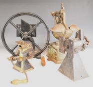 Four vintage hand cranked metal coffee grinders including Peugeot, tallest 37cm