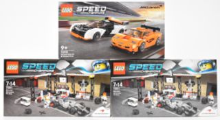 Three Lego Speed Champions McLaren racing car sets comprising two Pit Stop 75911 and Solus GT / F1