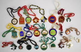 A collection of metal and enamel Irish horse racing badges including Naas Races 1949 onwards,