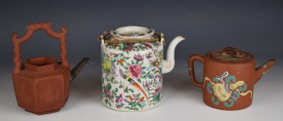 Three 19th / 20thC Chinese teapots comprising two Yixing, one with enamelled decoration and a