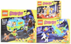 Three Lego Scooby-Doo! sets comprising The Mystery Machine 75902, Mystery Plane Adventures 75901 and