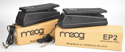 Two Moog EP-2 keyboard or synthesizer expression pedals, both in original boxes.