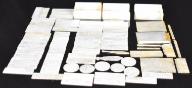 Sixty Chinese mother of pearl gaming counters contained in three mother of pearl boxes, all with