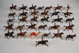 Thirty-two various Britains painted metal toy soldiers comprising mounted regiments and artillery