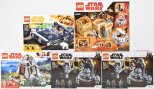 Five Lego Star Wars sets comprising Han Solo's Landspeeder 75209, Ahch-To Island Training 75200, Mos