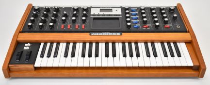 Mini Moog Voyager Analog Synthesizer with 44 keys, serial no. 2840 together with a Voyager VX-351 CV