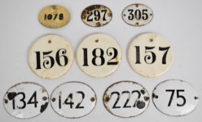 Seven enamel wine bin label / tickets, largest W8.5 x H7cm and three ceramic examples, diameter 8.