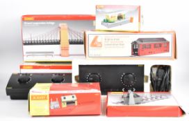 Two Hornby HM 2000 power controllers together with a small collection of buildings and accessories.