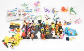 Sixty-four Lego minifigures and similar comprising sets 16, 17, The Batman Movie and UniKitty, all