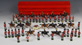 Fifty-four Britains painted metal toy soldiers to include Hussars and Scots Guard regiments,